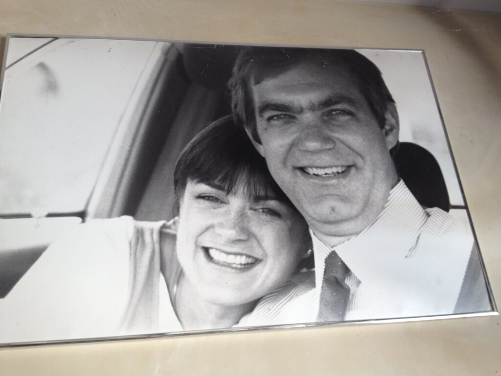 photo of a framed black and white photograph of James and Mary Beth when they were younger