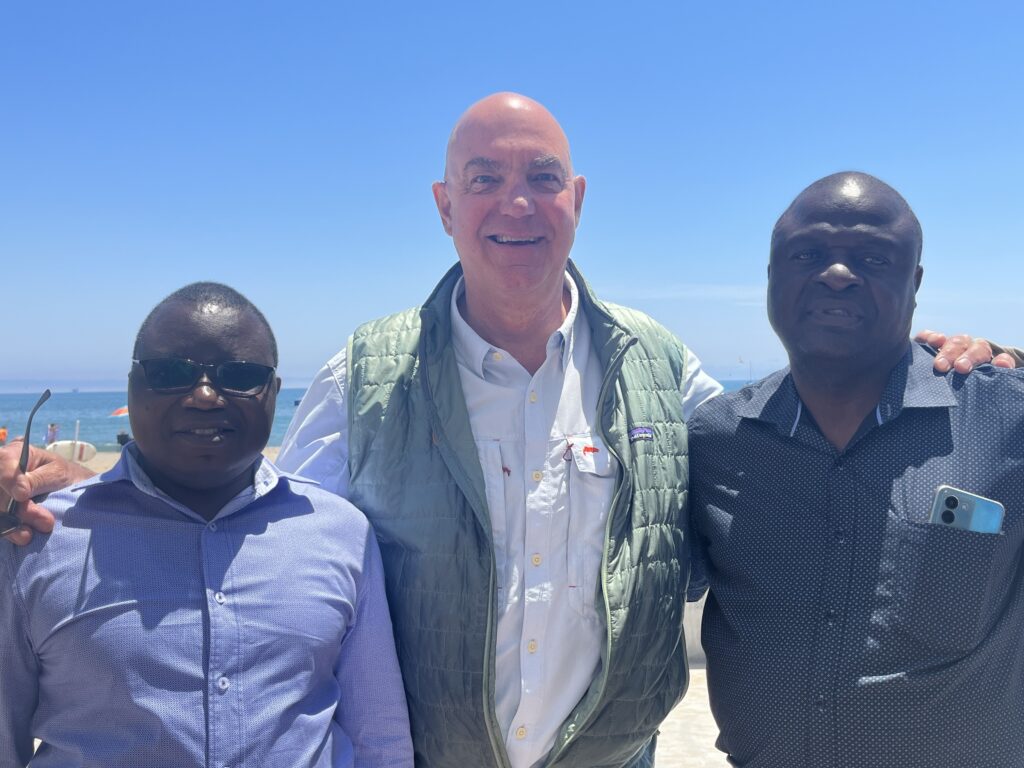 photo of James with two prison chaplains from Rwanda and Zambia